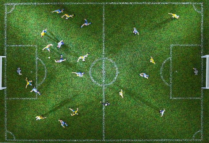 Miniature figurines of two soccer teams playing a soccer match, directly above Image: 0129612118, License: Royalty free, Restrictions: Not available for license to or for use in the following territories: Argentina, Brazil, Chile, Costa Rica, Ecuador, Japan, Mexico, Peru, Spain, Uruguay and Venezuela. For multi-territory license please contact your Corbis Account Representative. Not available for use in Corbis Merchandise., Property Release: No or not aplicable, Model Release: No or not aplicable, Credit line: Profimedia.cz, Corbis