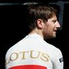 Lotus Formula One driver Romain Grosjean of France looks on during the first practice session of the Australian F1 Grand Prix at the Albert Park circuit in Melbourne