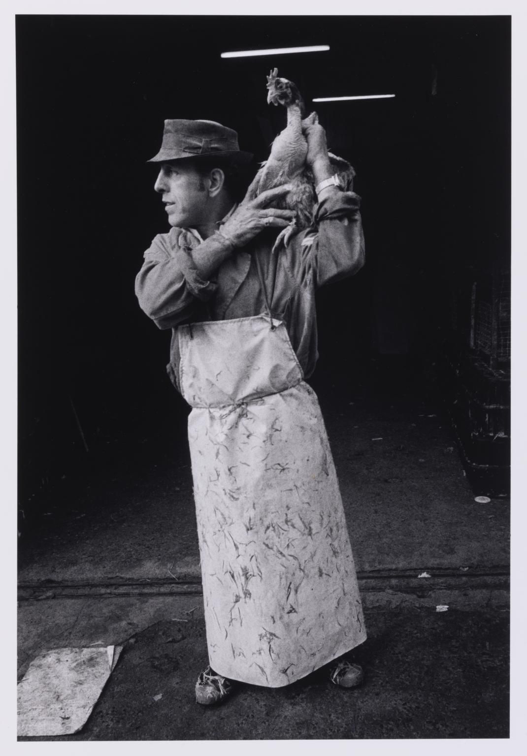 Markéta Luskačová: Man with the chicken, Leyden Street, London, 1976