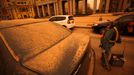 Streets and cars are covered with yellow dust amid a sandstorm in Beijing March 20, 2010. A severe sandstorm that plagued northwestern China in the past few weeks arrived in Beijing Friday night, packing strong winds and tonnes of sand, Xinhua News Agency said.