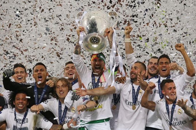 Real Madrid's Sergio Ramos lifts the trophy as they celebrate winning the UEFA Champions League