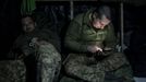 Ukrainian service members rest inside a dugout at a position near the front-line town of Bakhmut, amid Russia's attack on Ukraine, in Donetsk region, Ukraine December 21,