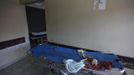 The feet of a dead man lying on a stretcher are seen inside the morgue of a local hospital in San Pedro Sula March 23, 2013. San Pedro Sula, the country's second largest city after Tegucigalpa, has a homicide rate of 169 per 100,000 people and was named the world's most violent city for a second year in a row. Lax laws allow civilians to own up to five personal guns. Arms trafficking has flooded the country with nearly 70% illegal firearms. 83.4% of homicides are by firearms, compared to 60% in the United States. Picture taken March 23, 2013. REUTERS/Jorge Cabrera (HONDURAS - Tags: CRIME LAW CIVIL UNREST HEALTH) ATTENTION EDITORS: PICTURE 34 OF 39 FOR PACKAGE 'GUN CULTURE - HONDURAS' SEARCH 'HONDURAS GUN' FOR ALL IMAGES Published: Dub. 5, 2013, 11:15 dop.