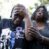 Loretta Thomas, 45, and Deshone, 50, listen to a Prince song at a vigil to celebrate the life and music of deceased musician Prince in Los Angeles