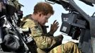 Britain's Prince Harry sits in the cockpit of an Apache helicopter in Camp Bastion, southern Afghanistan in this photograph taken October 31, 2012, and released January 21, 2013. The Prince, who is serving as a pilot/gunner with 662 Squadron Army Air Corps, is on a posting to Afghanistan that runs from September 2012 to January 2013. Photograph taken October 31, 2012. REUTERS/John Stillwell/Pool (AFGHANISTAN - Tags: MILITARY POLITICS SOCIETY ROYALS CONFLICT) Published: Led. 21, 2013, 7:57 odp.