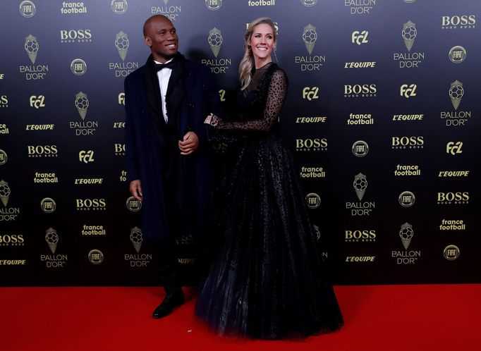 Soccer Football - The Ballon d’Or awards - Theatre du Chatelet, Paris, France - December 2, 2019   Ivory Coast legend Didier Drogba arrives with Sandy Heribert  REUTERS/C