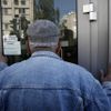 Fotogalerie: Perný den na Kypru. Dnes se tam otevřely zavřené banky.