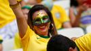 A fan of Brazil kisses the stomach of a fellow fan before their 2014 World Cup Group A soccer match against Mexico at the Castelao arena in Fortaleza June 17, 2014. REUTE