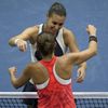 Flavia Pennetta of Italy hugs compatriot Roberta Vinci after winning the women's singles final match at the U.S. Open tennis tournament in New York