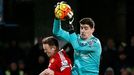 Chelsea's Thibaut Courtois in action with Manchester United's Wayne Rooney