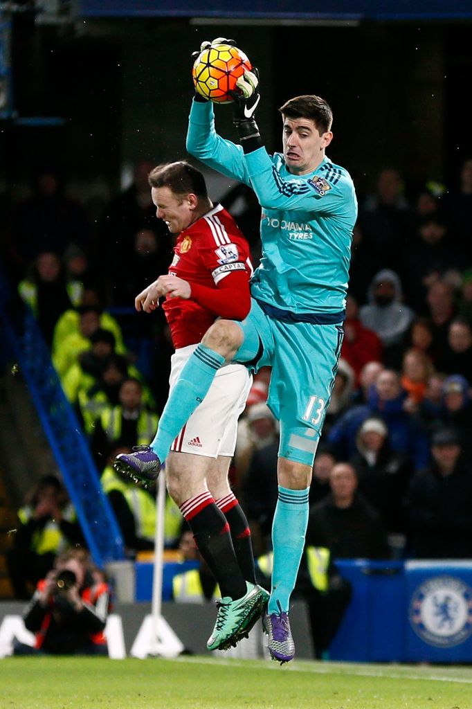 Chelsea's Thibaut Courtois in action with Manchester United's Wayne Rooney