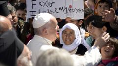 Pope Francis greets migrants and refugees at Moria refugee camp near the port of Mytilene, on the Greek island of Lesbos