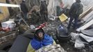 An anti-government protester rests at a barricade in Kiev February 21, 2014.