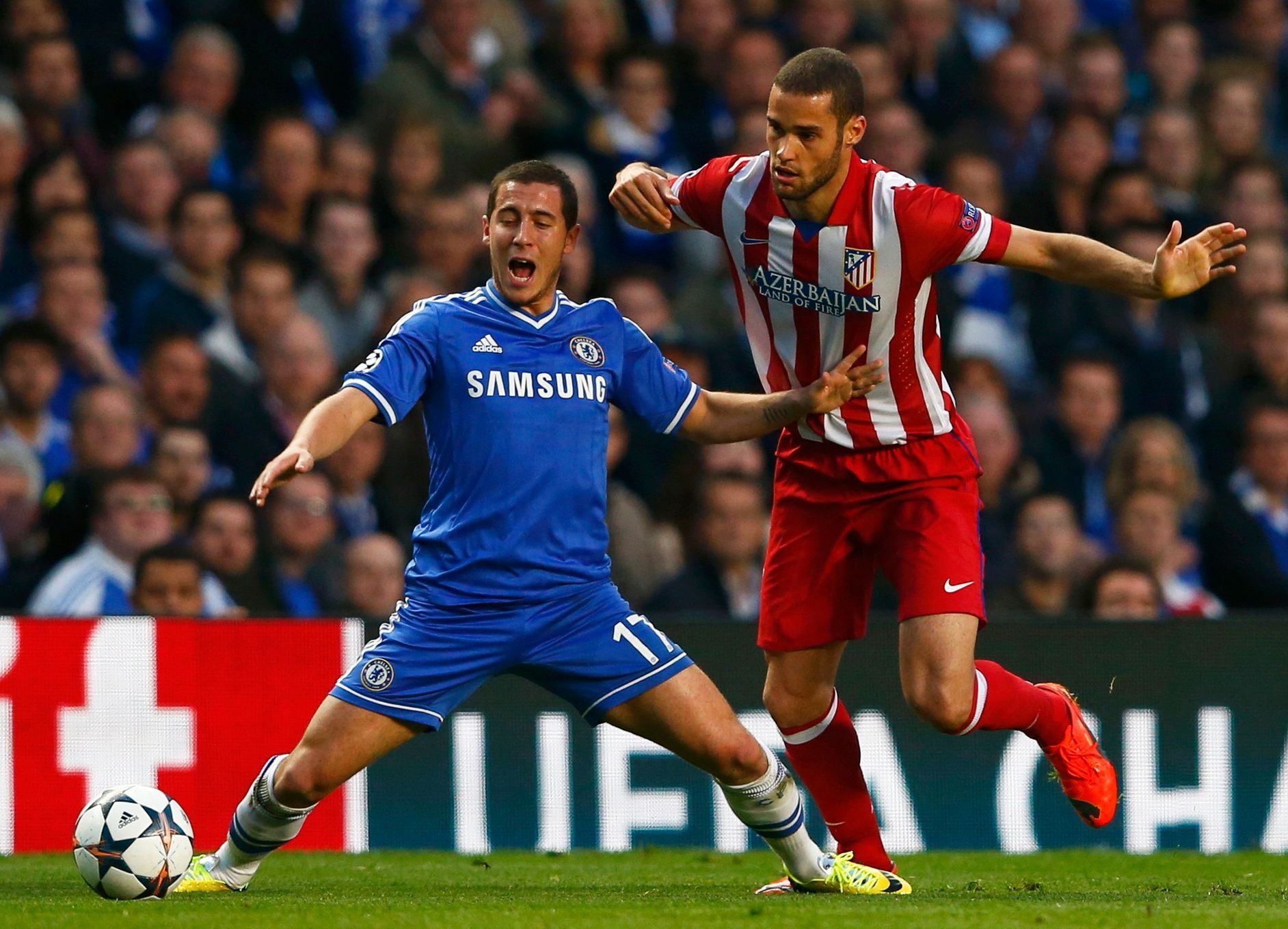Chelsea's Hazard is fouled by Atletico's Suarez during their Champions League semi-final second leg soccer match at Stamford Bridge in London