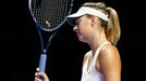 Maria Sharapova of Russia reacts after losing a point to Petra Kvitova of the Czech Republic during their WTA Finals tennis match at the Singapore Indoor Stadium October