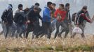 Migranti u řecko-tureckých hranic.