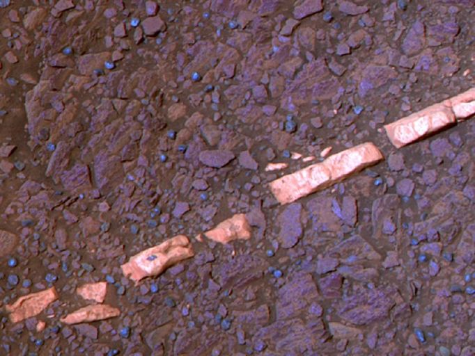 'Homestake' Vein, False Color This false-color view of a mineral vein called "Homestake" comes from the panoramic camera (Pancam) on NASA's Mars Exploration Rover Opportunity. The vein is about the width of a thumb and about 18 inches (45 centimeters) long. Opportunity examined it in November 2011 and found it to be rich in calcium and sulfur, possibly the calcium-sulfate mineral gypsum. Homestake is near the edge of the "Cape York" segment of the western rim of Endeavour Crater. Exposures combined into this view were taken through Pancam filters admitting light with wavelengths centered at 753 nanometers (near infrared), 535 nanometers (green) and 432 nanometers (violet). The view is presented in false color to make some differences between materials easier to see. The exposures were taken during the 2,769th Martian day, or sol, of Opportunity's career on Mars (Nov. 7, 2011). Image credit: NASA/JPL-Caltech/Cornell/ASU