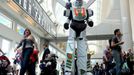 A man in a Transformers costume walks down the hall at the 2015 Comic-Con International in San Diego