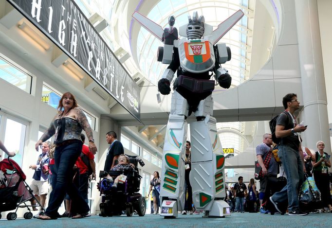 A man in a Transformers costume walks down the hall at the 2015 Comic-Con International in San Diego