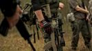 ¨ Members of the North Florida Survival Group wait for their leader to critique their performance during an enemy contact drill training exercise in Old Town, Florida, December 8, 2012.The group trains children and adults alike to handle weapons and survive in the wild. The group passionately supports the right of U.S. citizens to bear arms and its website states that it aims to teach "patriots to survive in order to protect and defend our Constitution against all enemy threats". Picture taken December 8, 2013. REUTERS/Brian Blanco (UNITED STATES - Tags: SOCIETY POLITICS) ATTENTION EDITORS: PICTURE 14 OF 20 FOR PACKAGE 'TRAINING CHILD SURVIVALISTS' SEARCH 'FLORIDA SURVIVAL' FOR ALL IMAGES Published: Úno. 22, 2013, 1:01 odp.