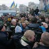 Members of Euromaidan movement, attempt to block radically behaving participants making way to stage during rally protesting