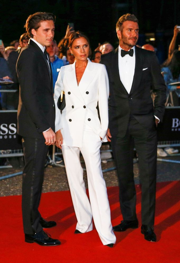 David Beckham, his wife Victoria Beckham and one of their sons, Brooklyn Beckham arrive to the GQ Men Of The Year Awards 2019 in London, Britain September 3, 2019. REUTER