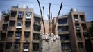 Twisted reinforcing bars from a building under demotion are seen at a residential area which will be relocated, in Huangtupo, Badong city, 100km (62 miles) from the Three Gorges dam in Hubei province in this August 8, 2012 file photo. China relocated 1.3 million people during the 17 years it took to complete the Three Gorges dam. Even after finishing the $59 billion project last month, the threat of landslides along the dam's banks will force tens of thousands to move again. It's a reminder of the social and environmental challenges that have dogged the world's largest hydroelectric project. While there has been little protest among residents who will be relocated a second time, the environmental fallout over other big investments in China has become a hot-button issue ahead of a leadership transition this year. Picture taken on August 8, 2012. To match story CHINA-THREEGORGES/ REUTERS/Carlos Barria/Files (CHINA - Tags: POLITICS ENVIRONMENT BUSINESS ENERGY) Published: Srp. 22, 2012, 8:34 odp.