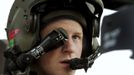 Britain's Prince Harry wears his monocle gun sight as he sits in his Apache helicopter in Camp Bastion, southern Afghanistan in this photograph taken December 12, 2012, and released January 21, 2013. The Prince, who is serving as a pilot/gunner with 662 Squadron Army Air Corps, is on a posting to Afghanistan that runs from September 2012 to January 2013. Photograph taken December 12, 2012. REUTERS/John Stillwell/Pool (AFGHANISTAN - Tags: ENTERTAINMENT MILITARY POLITICS ROYALS CONFLICT TPX IMAGES OF THE DAY)