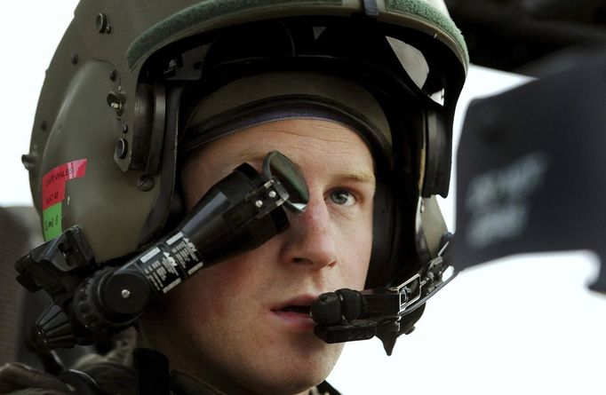 Britain's Prince Harry wears his monocle gun sight as he sits in his Apache helicopter in Camp Bastion, southern Afghanistan in this photograph taken December 12, 2012, and released January 21, 2013. The Prince, who is serving as a pilot/gunner with 662 Squadron Army Air Corps, is on a posting to Afghanistan that runs from September 2012 to January 2013. Photograph taken December 12, 2012. REUTERS/John Stillwell/Pool (AFGHANISTAN - Tags: ENTERTAINMENT MILITARY POLITICS ROYALS CONFLICT TPX IMAGES OF THE DAY)