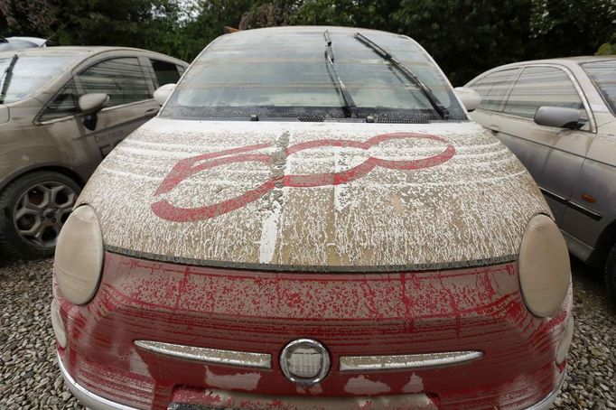 A thin film of mud covers a Fiat 500 after the floods of the nearby Danube river subsided at a car dealership in Fischerdorf, a suburb of the eastern Bavarian city of Deggendorf June 10, 2013. Tens of thousands of people have been forced to leave their homes and there have been at least a dozen deaths as a result of floods that have hit Germany, Austria, Slovakia, Poland and the Czech Republic over the past week. REUTERS/Wolfgang Rattay (GERMANY - Tags: DISASTER TRANSPORT)