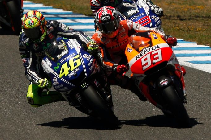 Honda MotoGP rider Marc Marquez of Spain (R) and Yamaha MotoGP rider Valentino Rossi of Italy take a curve during the Spanish Grand Prix at Jerez racetrack in Jerez de la