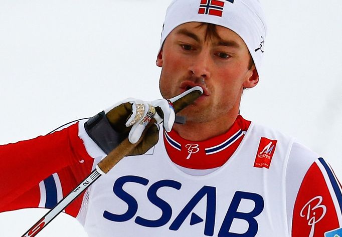 Norway's Northug crosses the finish line ahead of Sweden's Halfvarsson to win the men's cross country free/classic 4 x 10 km relay final at the Nordic World Ski Champions