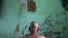 Mahesh Chaturvedi, 63, who dresses up like Mahatma Gandhi, is seen at his residence in the outskirts of New Delhi October 23, 2012. Chaturvedi says that the soul of Gandhi resides in him and he has been sent to continue the work of Father of the Nation. After his self proclaimed transformation in 2002 as Gandhi, Chaturvedi has been travelling extensively and plays up to his startling resemblance to Gandhi at protests and demonstrations. Picture taken October 23, 2012. REUTERS/Mansi Thapliyal (INDIA - Tags: SOCIETY) Published: Lis. 26, 2012, 3:53 dop.