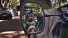 A French soldier is reflected in the mirror of a military jeep in Niono January 20, 2013. France and West African leaders called on Saturday on other world powers to commit money and logistical support for African armies readying their troops to join French soldiers already battling al Qaeda-linked militants in Mali. REUTERS/Joe Penney (MALI - Tags: CIVIL UNREST POLITICS MILITARY CONFLICT) Published: Led. 20, 2013, 1:38 odp.