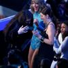 Lorde reacts with singer Taylor Swift and an unidentified guest during the 2014 MTV Video Music Awards in Inglewood