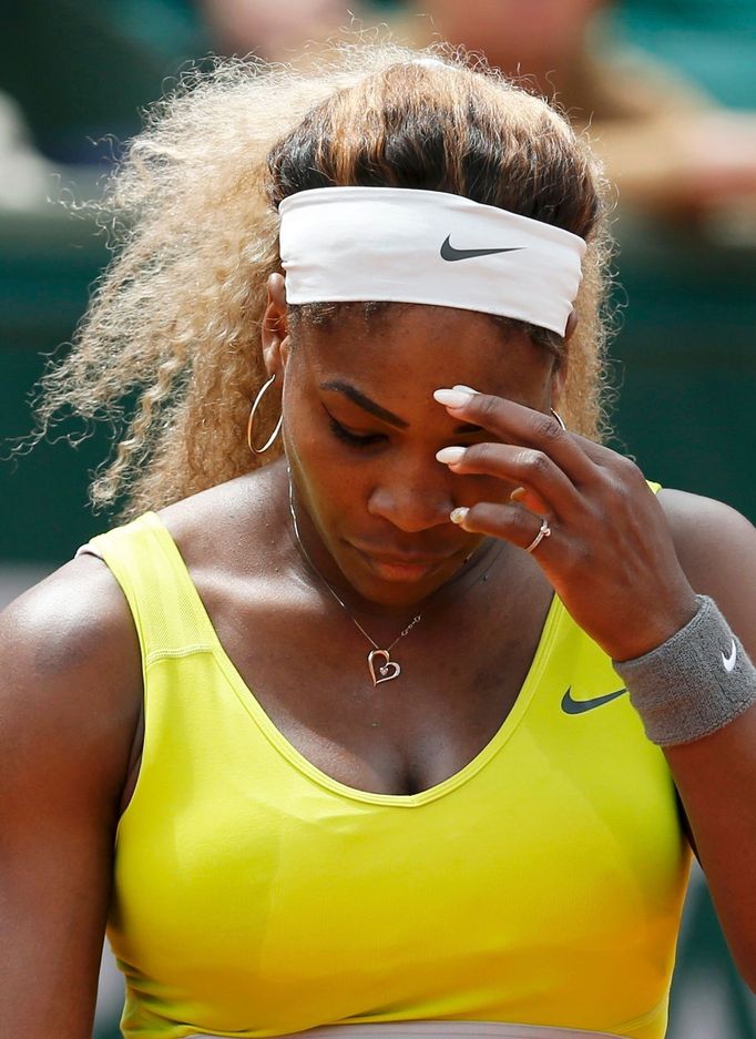 Serena Williams of the U.S. reacts during her women's singles match against Garbine Muguruza of Spain at the French Open tennis tournament at the Roland Garros stadium in