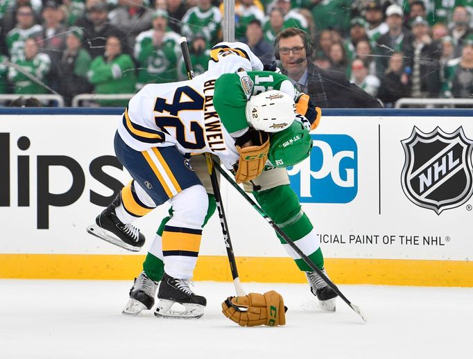 Jan 1, 2020; Dallas, TX, USA; Nashville Predators center Colin Blackwell (42) fights Dallas Stars center Radek Faksa (12) during the first period in the 2020 Winter Class