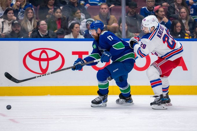 Nov 19, 2024; Vancouver, British Columbia, CAN; New York Rangers forward Chris Kreider (20) pursues Vancouver Canucks defenseman Filip Hronek (17) during the first period