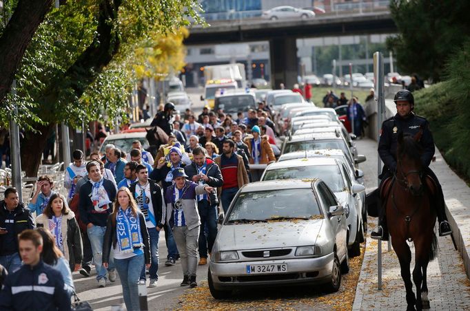 Spanish police escort Deportivo Coruna fans upon leaving Vicente Calderon stadium after their Spanish first division soccer match against Atletico Madrid in Madrid