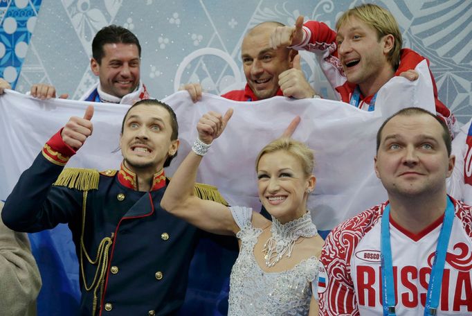 Tatiana Volosozhar and Maxim Trankov of Russia compete during the Team Pairs Short Program at the Sochi 2014 Winter Olympics