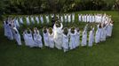 Buddhist nun prays with novice Thai nuns at the Sathira Dammasathan Buddhist meditation centre in Bangkok