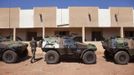 A French soldier walks past Armoured Personnel Carriers parked at a Malian air base in Bamako January 15, 2013. The French army sent some 50 armoured vehicles to Mali from their military base in Ivory Coast, which arrived late Monday night. France hit Islamist rebels in Mali with fresh air strikes and deployed armoured cars on Tuesday, stepping up its intervention in the West African state as regional allies struggled to accelerate their plans to send in troops. REUTERS/Joe Penney (MALI - Tags: CIVIL UNREST POLITICS CONFLICT) Published: Led. 15, 2013, 2:29 odp.