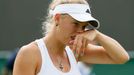 Caroline Wozniacki of Denmark reacts during her women's singles tennis match against Petra Cetkovska of the Czech Republic at the Wimbledon Tennis Championships, in Londo