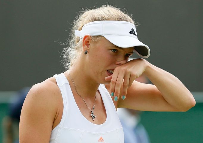 Caroline Wozniacki of Denmark reacts during her women's singles tennis match against Petra Cetkovska of the Czech Republic at the Wimbledon Tennis Championships, in Londo