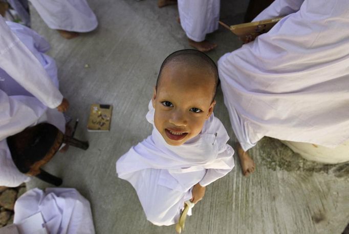 A novice Thai nun smiles at the Sathira Dammasathan Buddhist meditation centre in Bangkok