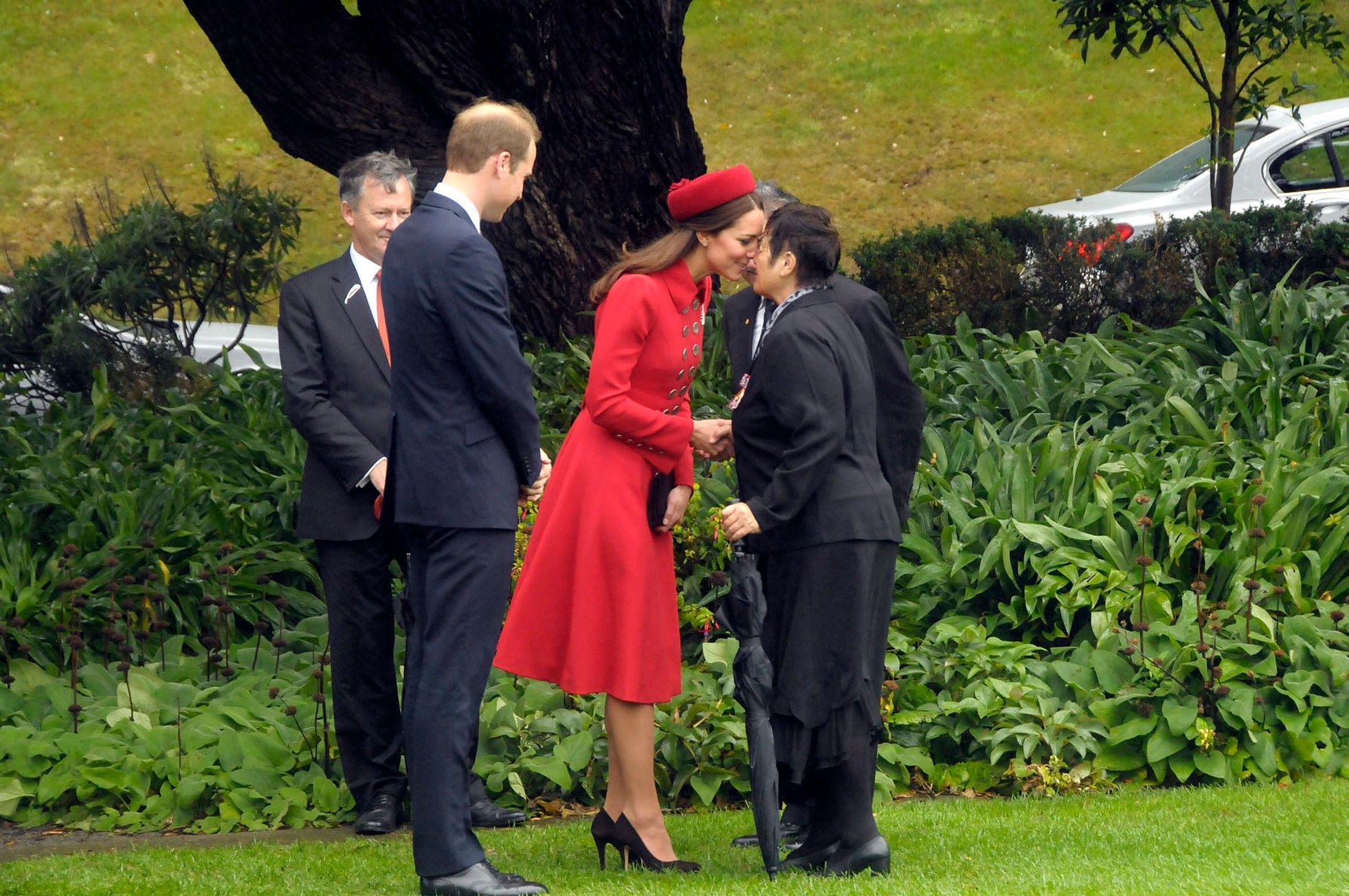 Britain's Prince William watches as his wife Catherine receives a Maori welcome known as a 'Hongi' in Wellington