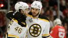 Boston Bruins center David Krejci (46) and Nathan Horton (18) celebrate assisting on Milan Lucic's first period goal against the Chicago Blackhawks during Game 1 of their