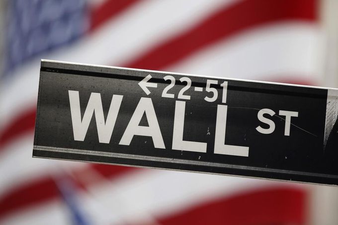 A street sign stands outside the New York Stock Exchange on Wall Street in New York in this file photo taken August 19, 2011. Wall Street is ramping up a campaign against