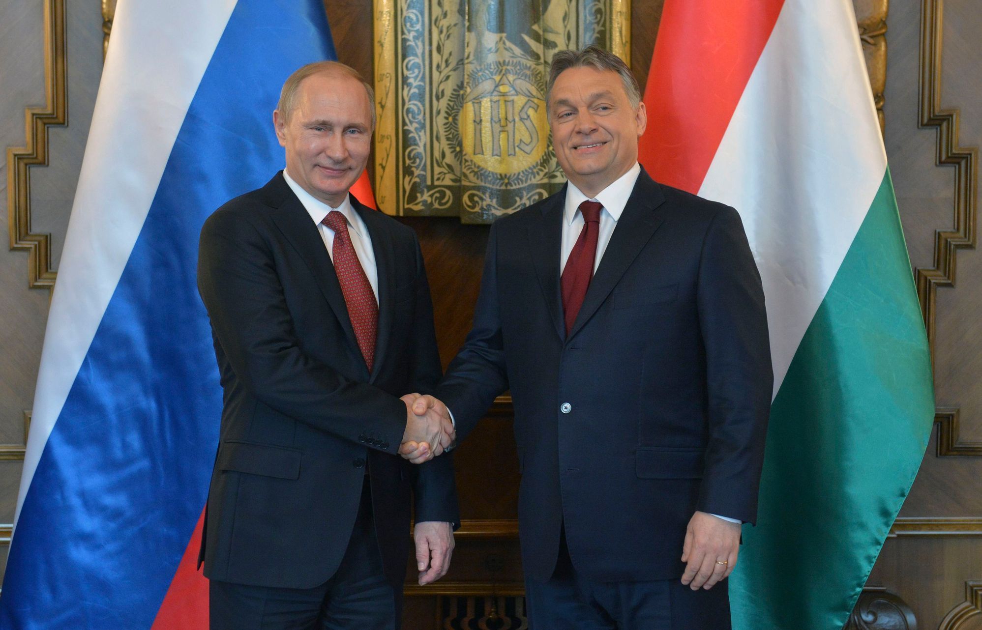 Russia's President Putin shakes hands with Hungarian Prime Minister Orban during their meeting in Budapest