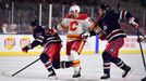 NHL 2019/2020, Heritage Classic, Calgary Flames - Winnipeg Jets: Tobias Rieder (16) skates through defenseman Josh Morrissey (44) and defenseman Tucker Poolman (3).